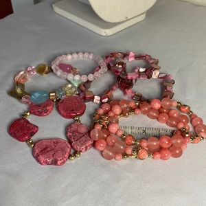 Group of seven pink peach stretch bracelets